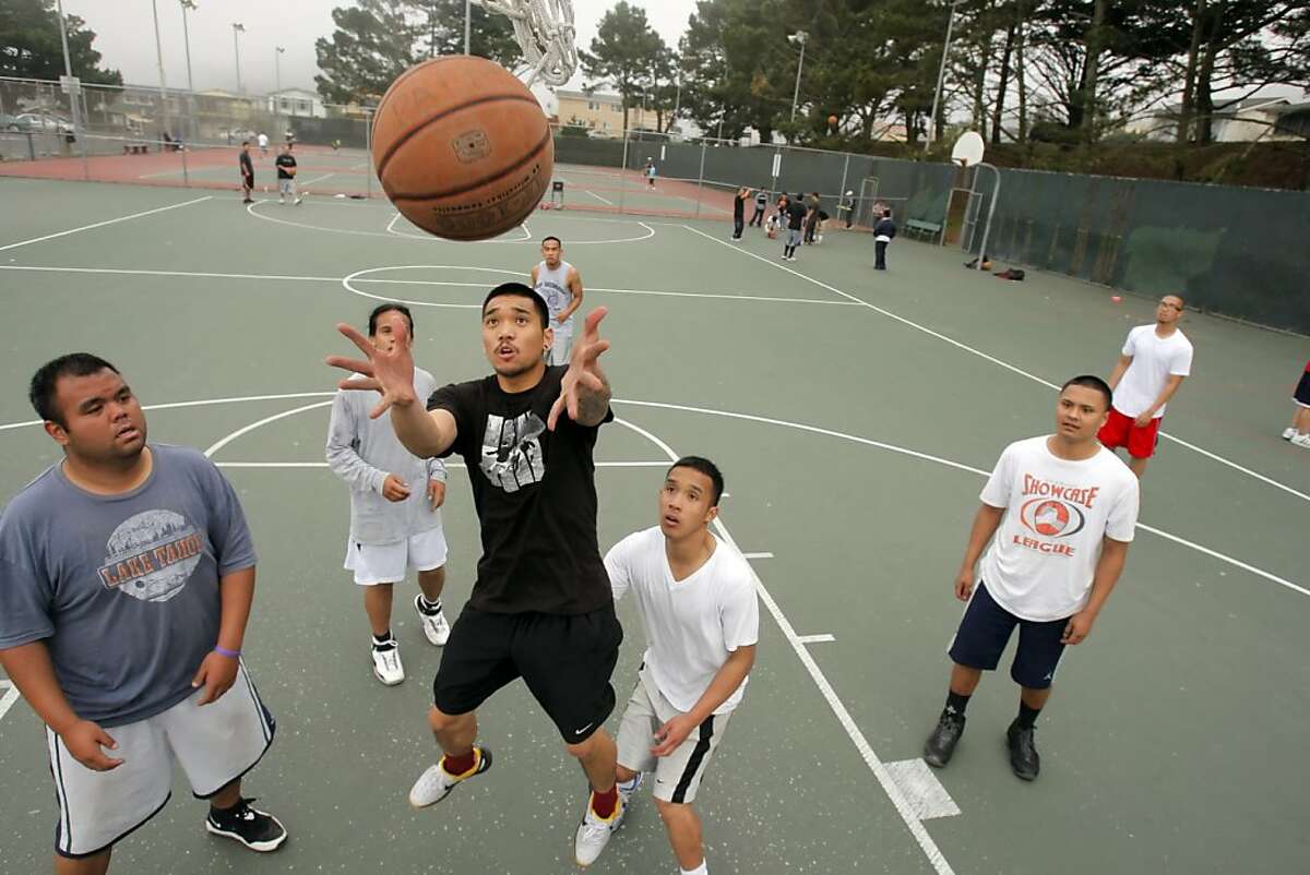 A group of friends plays a pick up game of basketball at Gellert Park in Daly City, Calif., on Wednesday, March 21, 2012. Census figures show that Daly City, Calif., has the highest percentage of Asians, and specifically Filipinos, in the nation.