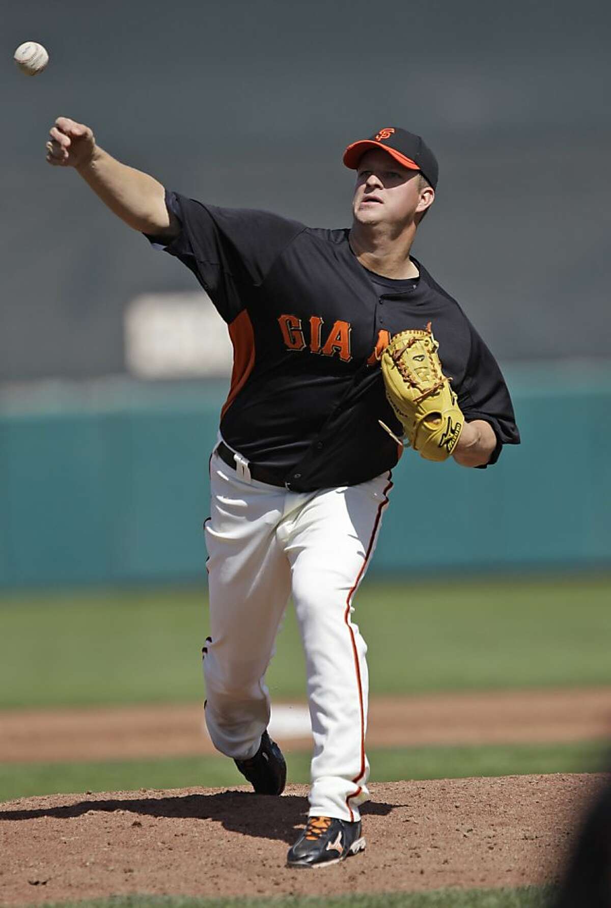 San Francisco Giants starting pitcher Matt Cain throws to the Cincinnati Reds during the third inning of a spring training baseball game Friday, March 9, 2012 in Scottsdale, Ariz. (AP Photo/Marcio Jose Sanchez)