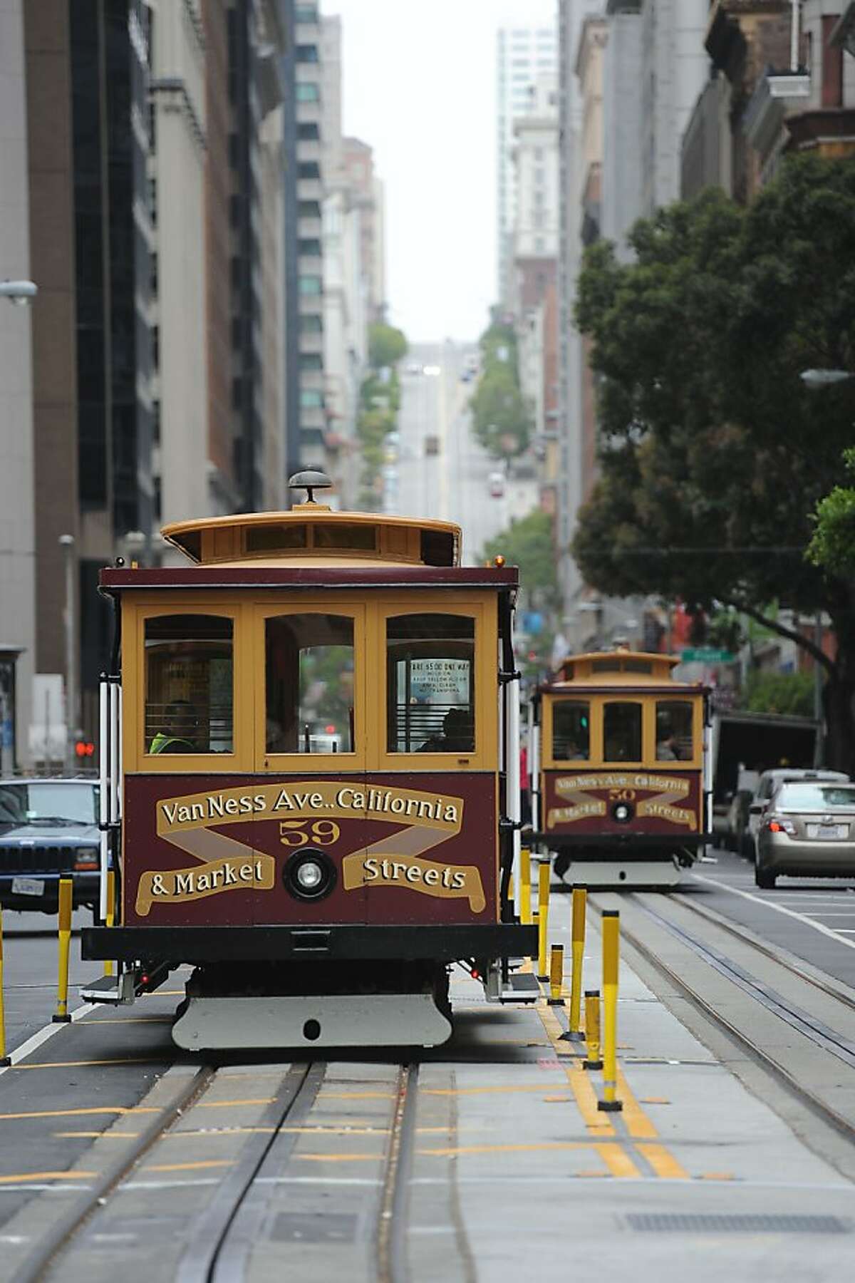 California St. cable cars are seen in San Francisco on June 27, 2011. The city held a ribbon cutting ceremony to welcome back the line after being closed due to repairs since December.