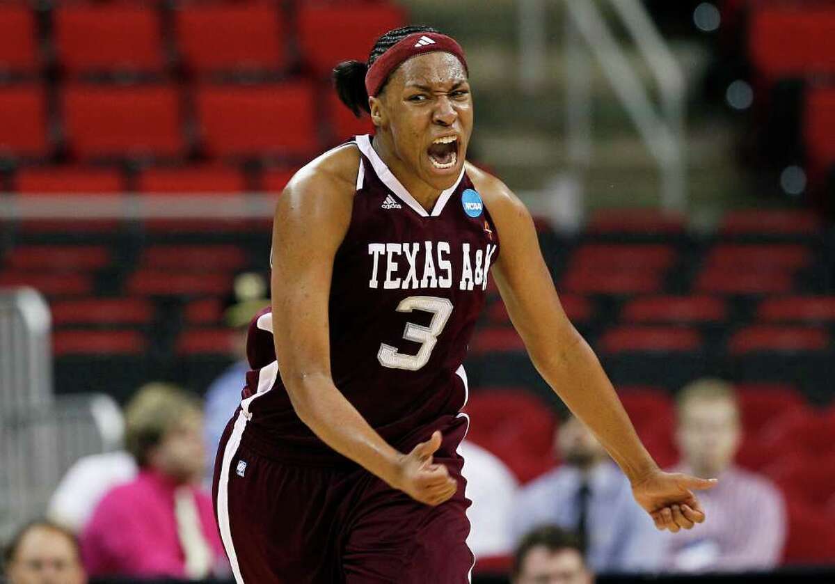 Texas A&M's Kelsey Bone (3) reacts following her basket against Maryland during the first half of an NCAA college women's tournament regional semifinal basketball game in Raleigh, N.C., Sunday, March 25, 2012. Maryland won 81-74. (AP Photo/Gerry Broome)