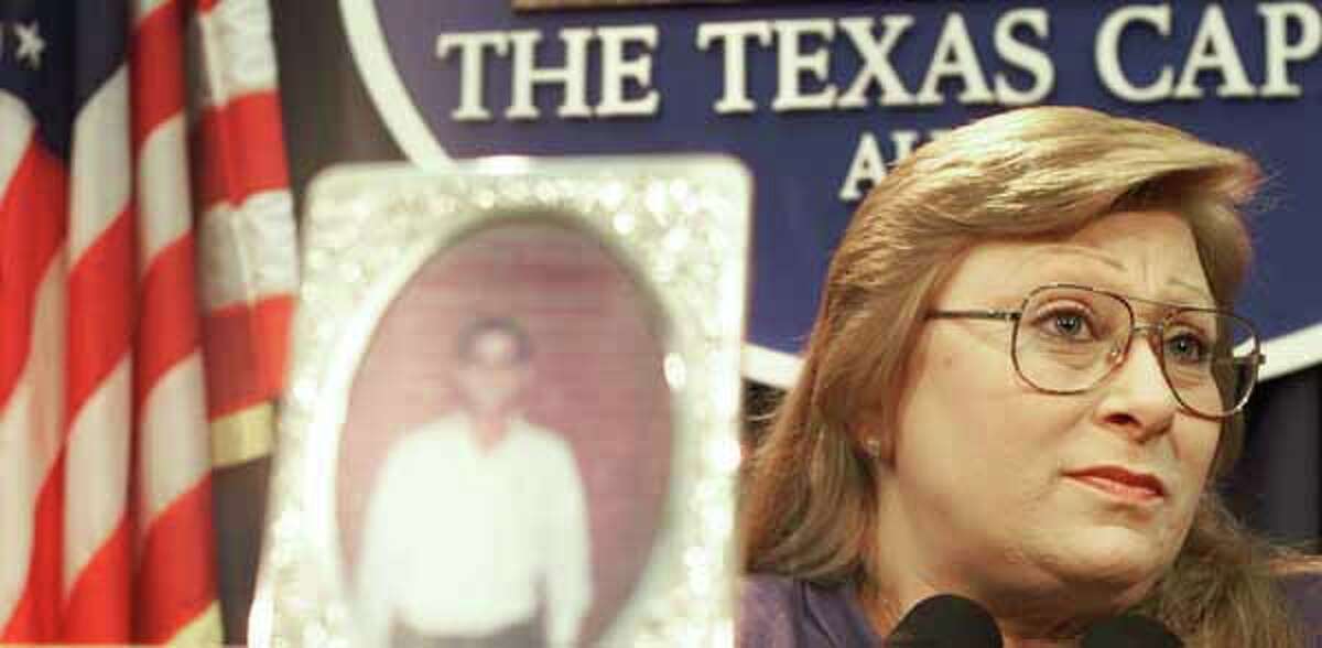 Sally Belinda Gonzales, sister of Texas Death Row inmate Johnny Paul Penry, shown in the foreground photo, speaks during a news conference where she pleaded for her brother's life, Wednesday, Nov. 15, 2000, in Austin, Texas.  (AP Photo/Harry Cabluck)