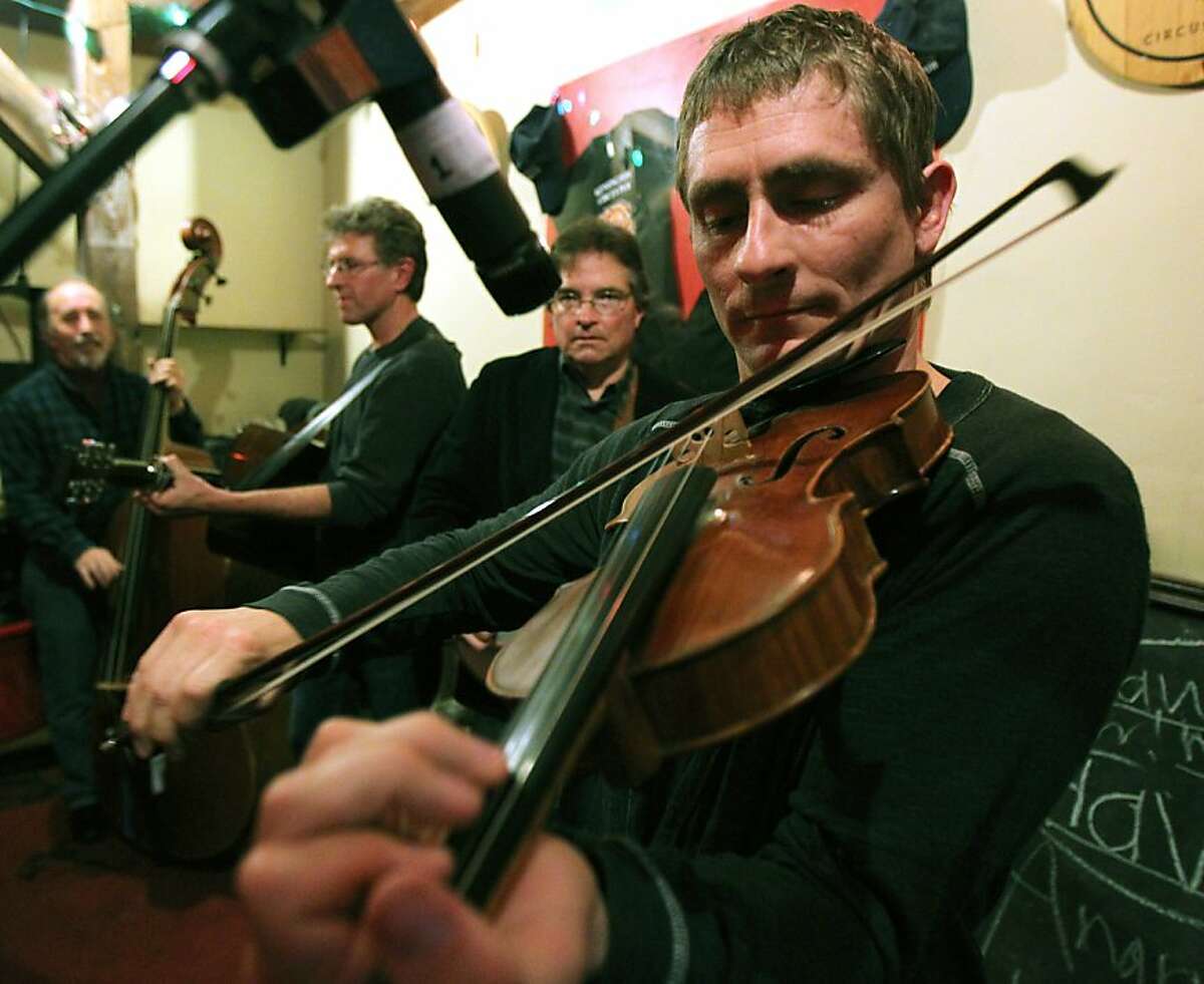 Bangers and Grass member Chad Manning, plays his fiddle during a night of old time music Thursday, March 15, 2012 at The Kensington Circus Pub in Kensington Calif.