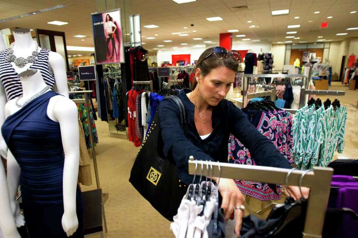 Caroline Waltermire shops for clothes at Dillard's in Memorial City Mall Wednesday, March 21, 2012, in Houston. "People have been telling me how Dillard's has stepped it up a notch," Waltermire said.