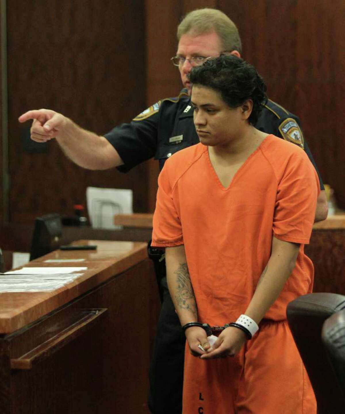 Luis Hector Lopez-Rodriguez, 27, who is a suspected drunk driver accused of crashing into a home killing one child and injuring another, is escorted from the 185th State District Court at the Harris County Criminal Courthouse, 1201 Franklin, Tuesday, March 20, 2012, in Houston. He is accused of losing control of the car he was driving and plowing into the front porch of an apartment, where two children were playing during a Saturday night party. Jesus Ordonez, 7, was killed when the vehicle rammed into the front porch and Christopher Cruz, 4, was in critical condition with burns over 40 percent of his body. ( Melissa Phillip / Houston Chronicle )