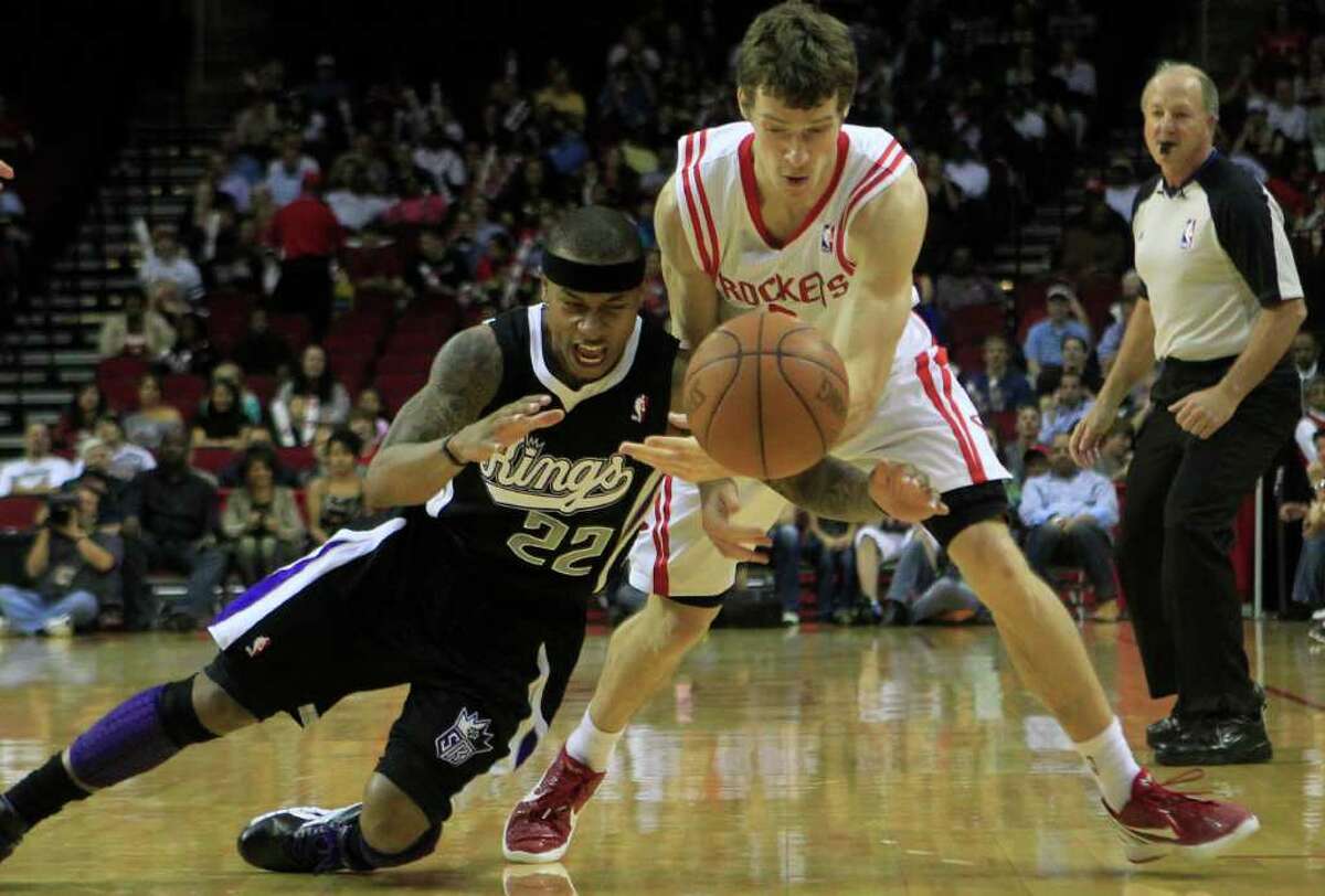 Sacramento Kings point guard Isaiah Thomas, 22, knocks the ball lose from Houston Rockets point guard Goran Dragic (3) during the first half of a basketball game at the Toyota Center Monday, March 26, 2012, in Houston.