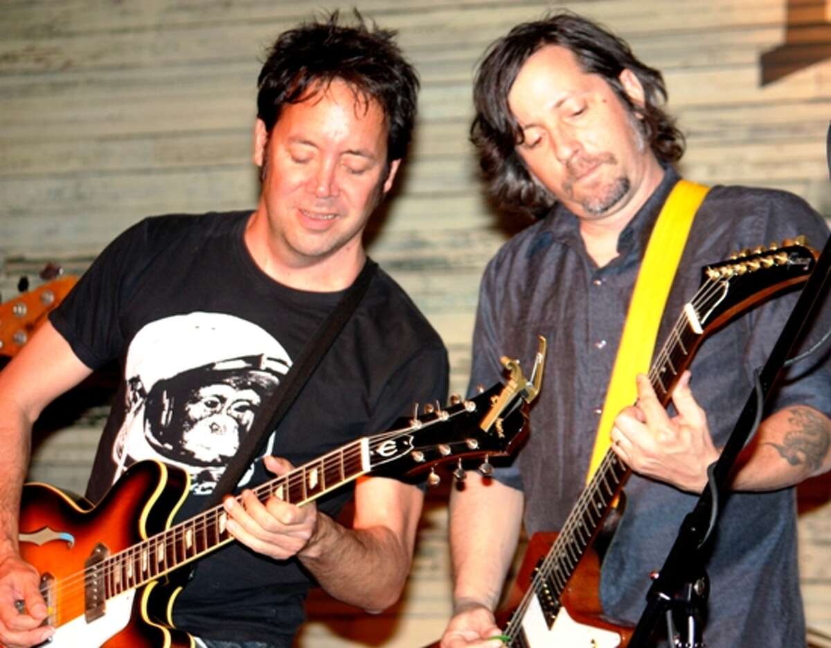 Miles Zuniga (left) and Tony Scalzo of Austin rock band Fastball trade licks at the Phoenix Saloon in New Braunfels April 9, 2011