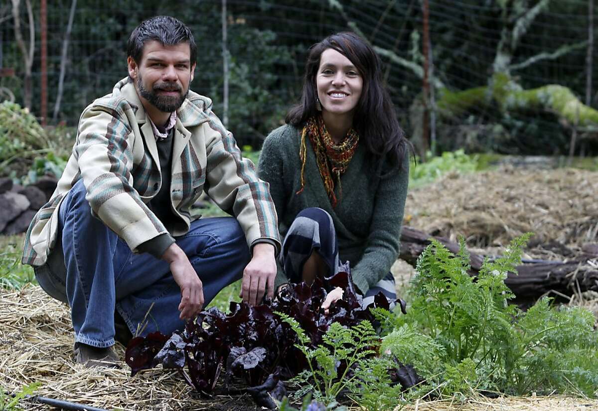 Matthew Hoffman and Astrid Lindo, co-founders of The Living Seed Company, work in their garden in Nicasio, Calif. on Monday, Feb. 20, 2012.