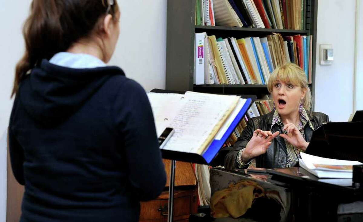 Actress Kristin Huffman, who teaches in the music department at Western Connecticut State University, gives voice lessons to Megan Kellog, 21, of Stamford, a junior at the Danbury college, Tuesday, March 27, 2012.