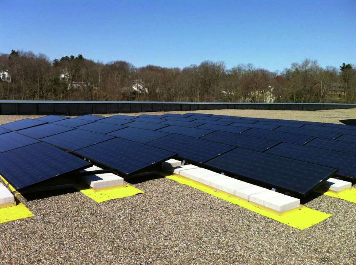 Town officials unveiled a new solar panel system on the roof of the science wing at Greenwich High School Tuesday, March 27, 2012. The system was partially funded by a grant from the Clean Energy Finance and Investment Authority's Clean Energy Communities Program.