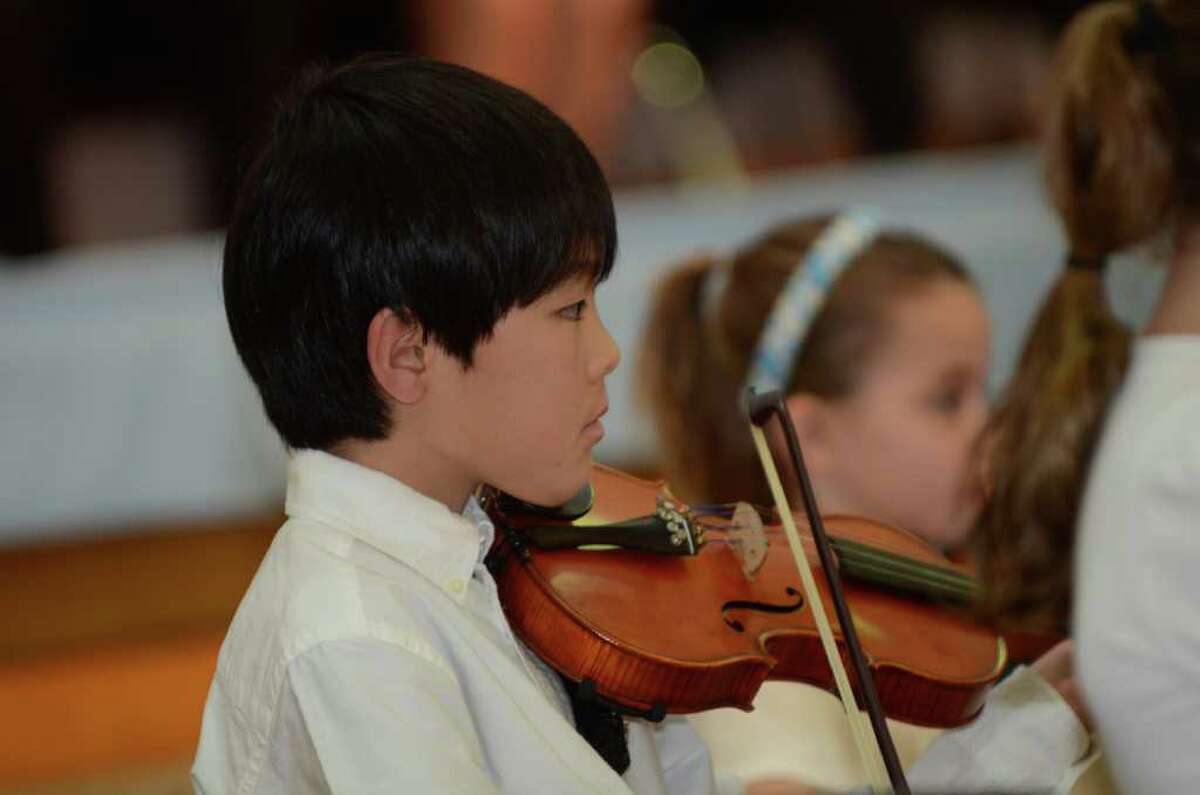 Old Greenwich Elementary School band student Yoshitaro Awazu plays the violin during the Greenwich Public Schools annual Community Service Awards at the Old Greenwich School auditorium on Tuesday, Mar. 27, 2012.