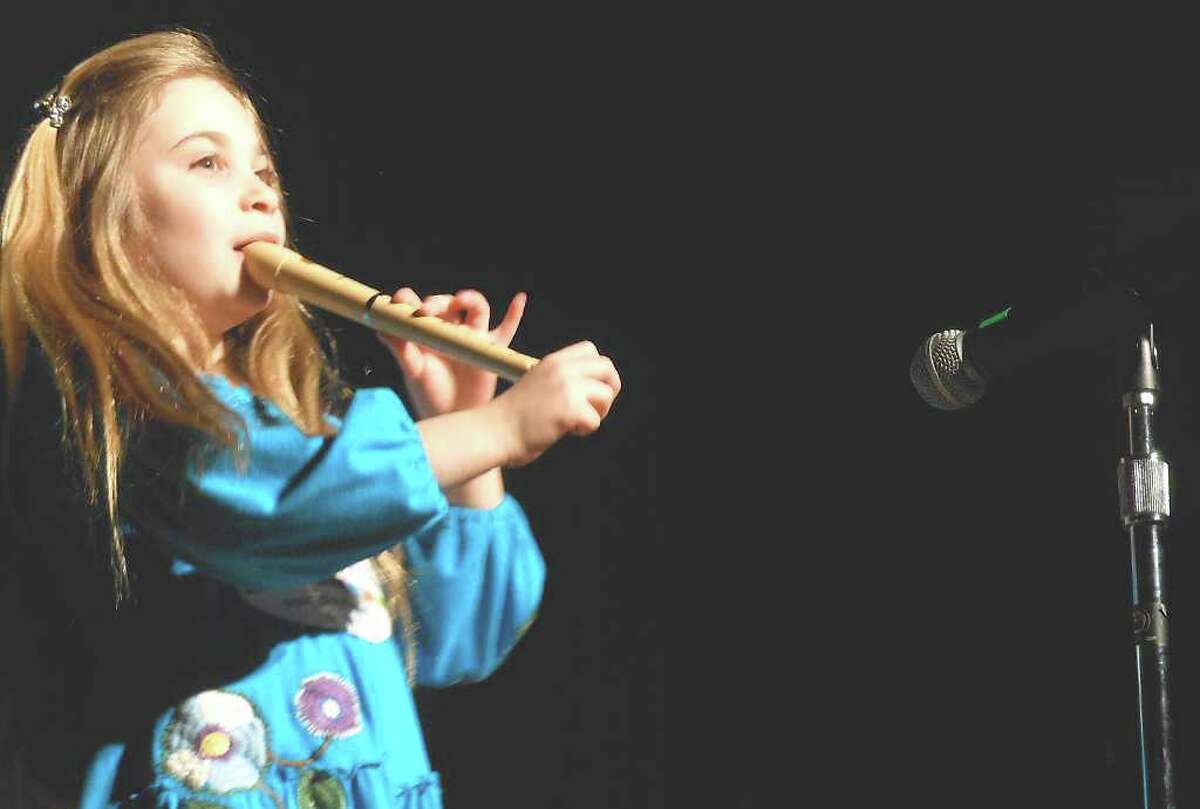 Lilly Weisz plays "Hot Cross Buns" on a recorder at the Kings Highway School variety show Tuesday, benefiting the Hole in the Wall Gang Camp founded by the late actor Paul Newman, a Westport resident.
