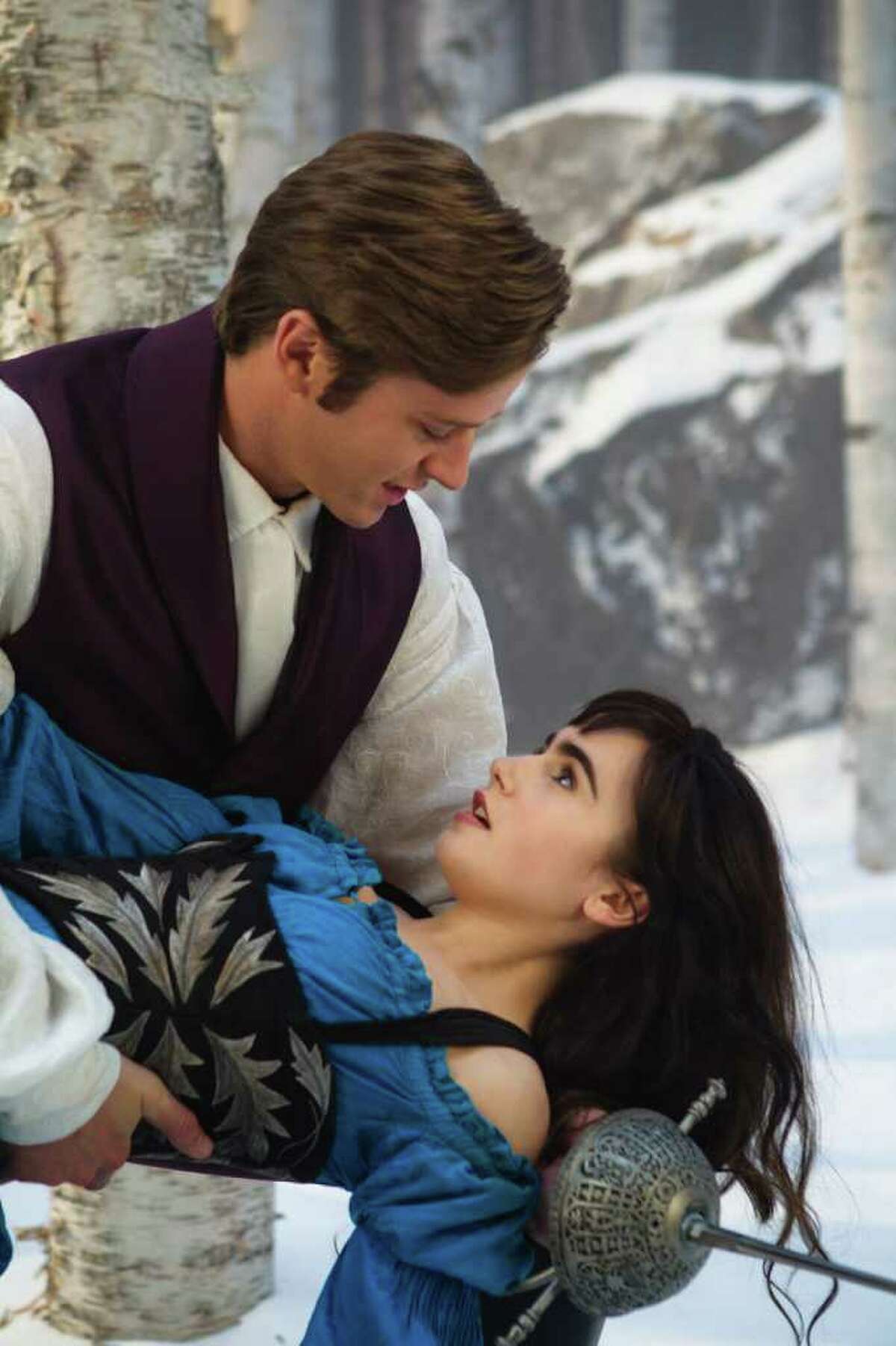 In this film image released by Relativity Media, Armie Hammer and Lily Collins are shown in a scene from, "Mirror Mirror."