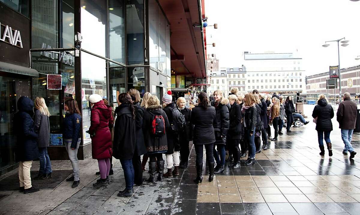 In this photo taken Tuesday March 20, 2012, people queue up to enter the Lunch Beat event at a cultural center in central Stockholm. Lunch Beat events are held monthly in Stockholm to crowds of hundreds where organizers say the party starts at noon and goes on for one hour. There is no alcohol, which means there's a different ambiance compared to nighttime clubbing.