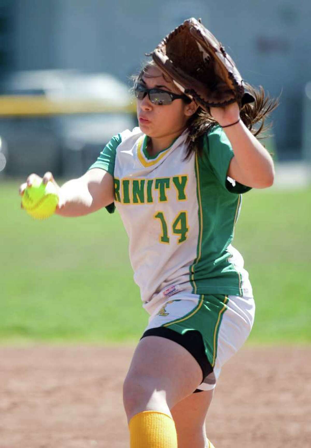 Trinity Catholic's Krissy Schule delivers to the plate against Westhill in softball action in Stamford, Conn. on Saturday April 9, 2011. Westhill won 6-0.