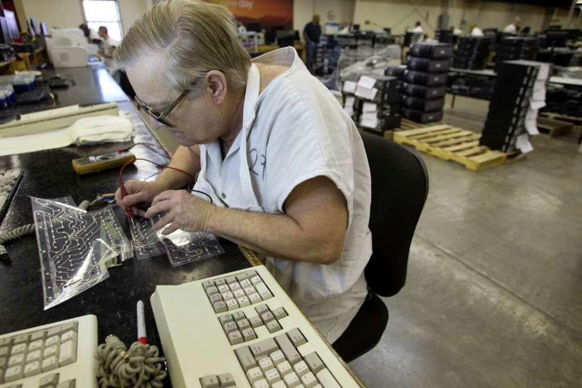 John Hargrove rebuilds keyboards in the Computer Recovery plant at the Wynne Unit Monday, March 26, 2012, in Huntsville. Texas Correctional Industries provides a variety of goods for use throughout the Texas Department of Criminal Justice and other state agencies. There are 5,200 inmates assigned to TCI in 37 factories statewide.