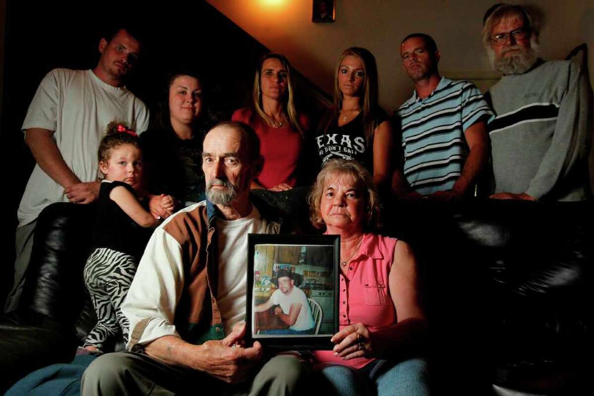 Mark Rhineburger's family, clockwise from front right: stepmother Nancy, father David Rhineburger, granddaughter Faith Hill, nephew Matthew, daughter Amanda, sister-in-law Christina, niece Brittany, brother Luke and uncle Terry.