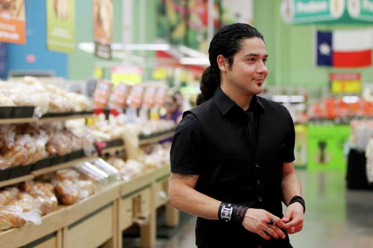 Chris Perez poses for pictures Wednesday, March 7, 2012 during a book signing at the H-E-B Plus in Corpus Christi, Texas. Perez wrote the new book, "To Selena, With Love," about his romance and marriage with the slain Tejano singer. (AP Photo/Corpus Christi Caller-Times, Michael Zamora)