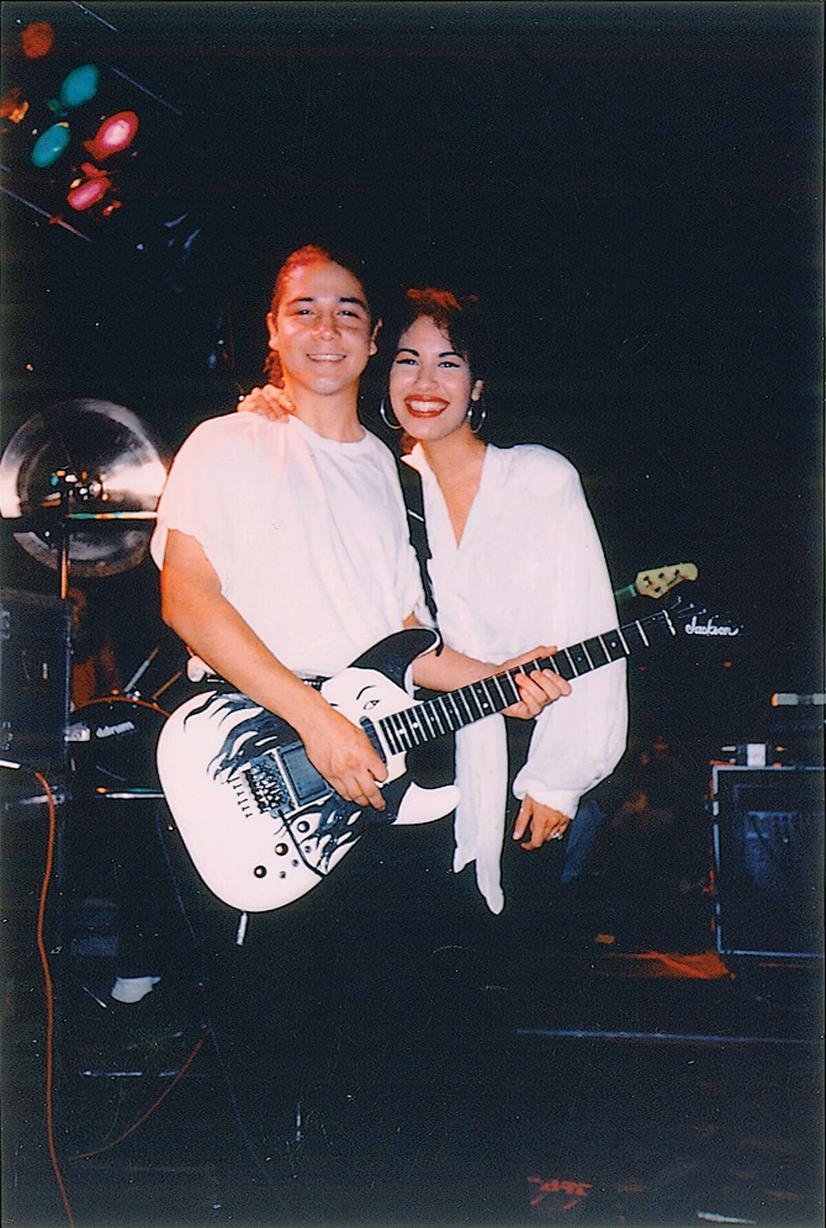 Selena onstage with her husband, guitarist Chris Perez.