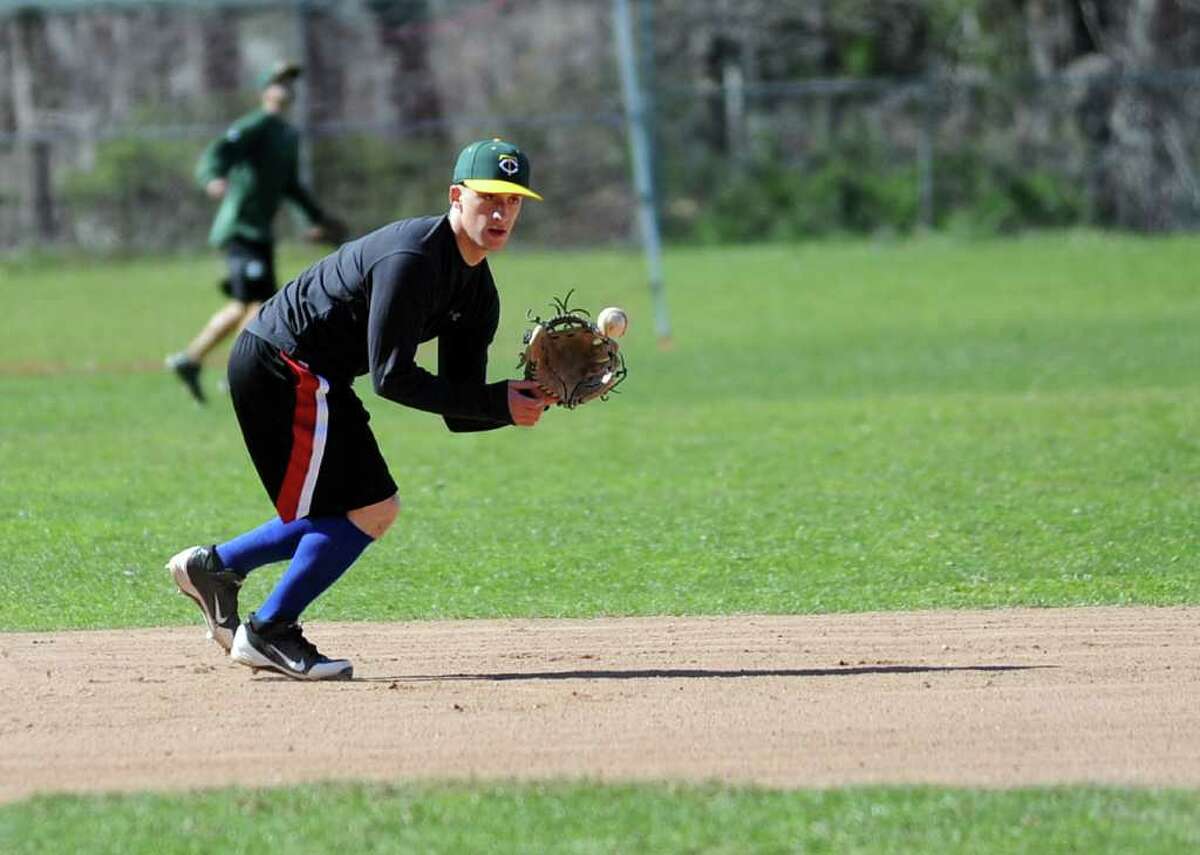 Mike Palomba fields a ball during baseball practice at Trinity Catholic High School on Friday, April 30, 2012.