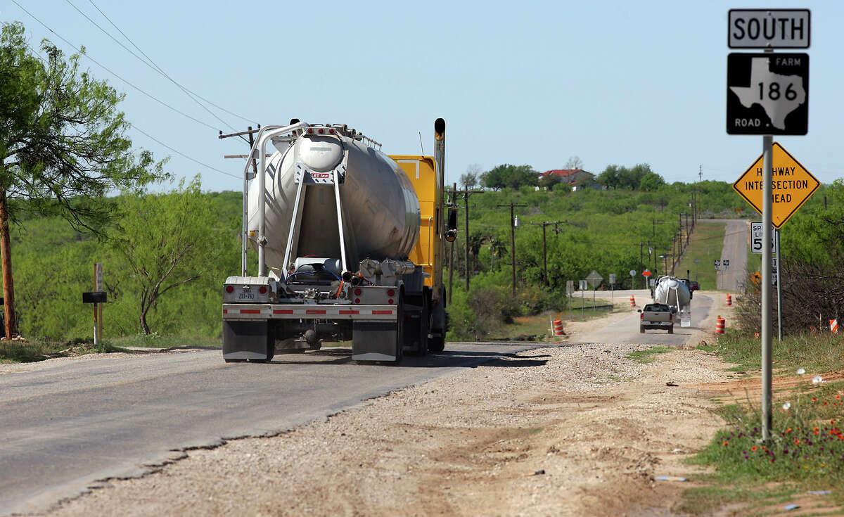 Traffic like this on FM 186 near Carrizo Springs is up across a 20-county swath of rural South Texas. Officials in the area are struggling to manage crumbling roads on limited budgets.