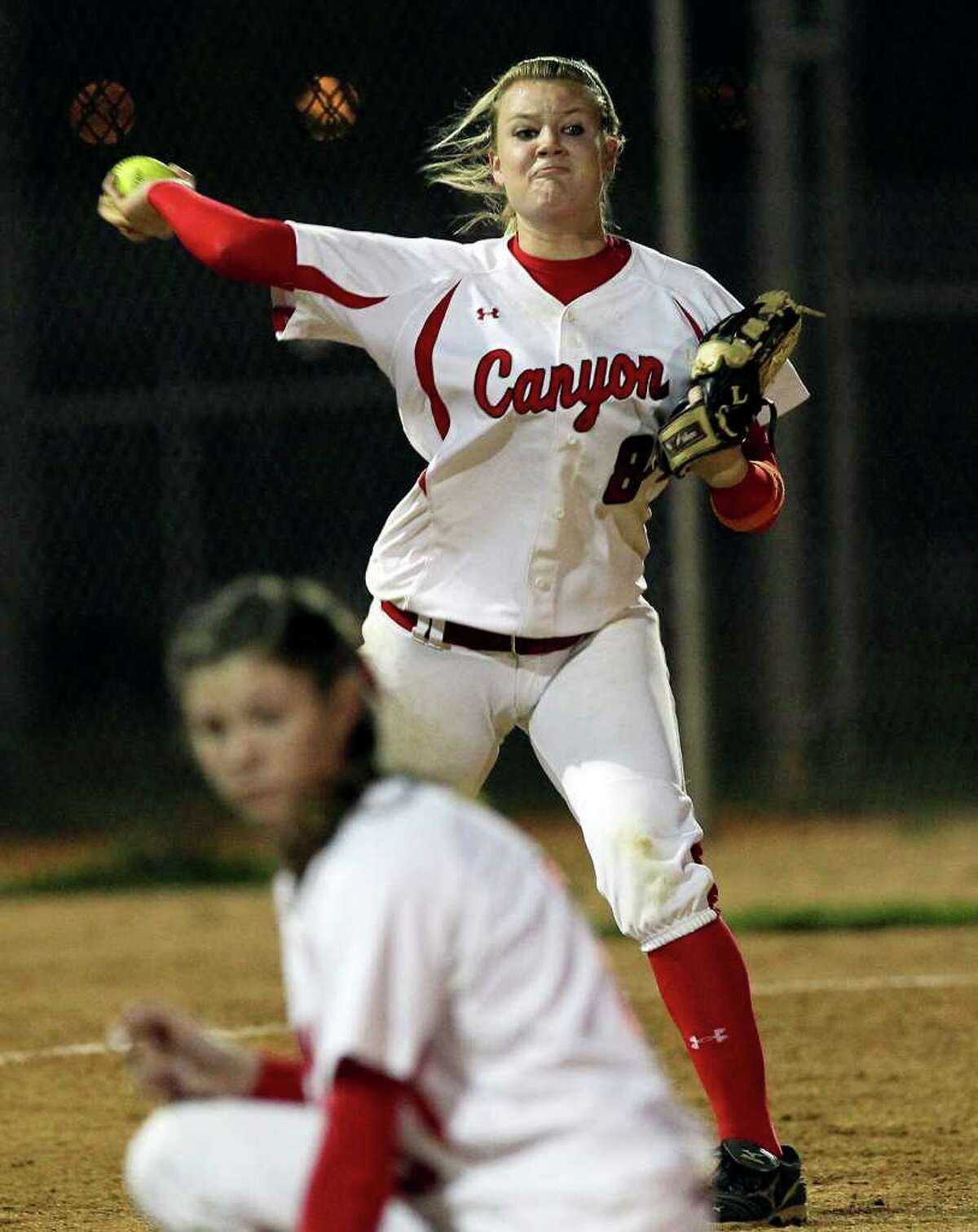 Kaitlyn Hollingshead fires to first for the Cougars as Canyon host Smithson Valley in softball on March 30, 2012. Tom Reel/ San Antonio Express-News