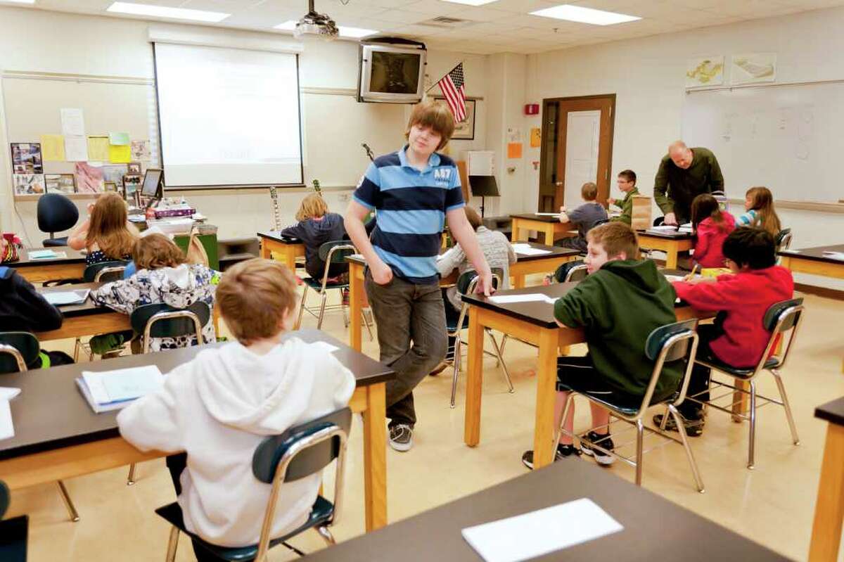 Ben Heckmann, 14, who has self-published two books about a fictional band, speaks to students during a reading at Boeckman Middle School in Farmington, Minn., last month. Print-on-demand technology and self-publishing companies have inspired writers of all ages to get their bylines on the printed page.