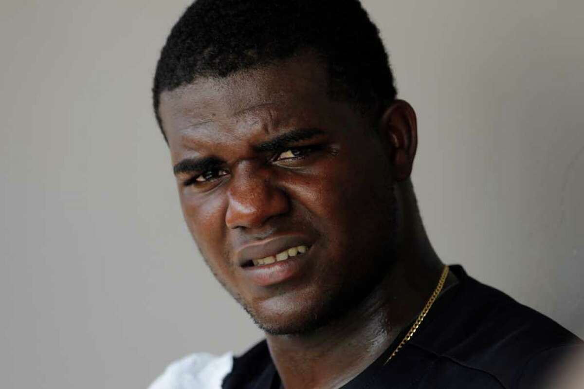 New York Yankees starting pitcher Michael Pineda watches from the dugout against the Washington Nationals during a spring training baseball game in Viera, Fla., Thursday, March 15, 2012. (AP Photo/Paul Sancya)