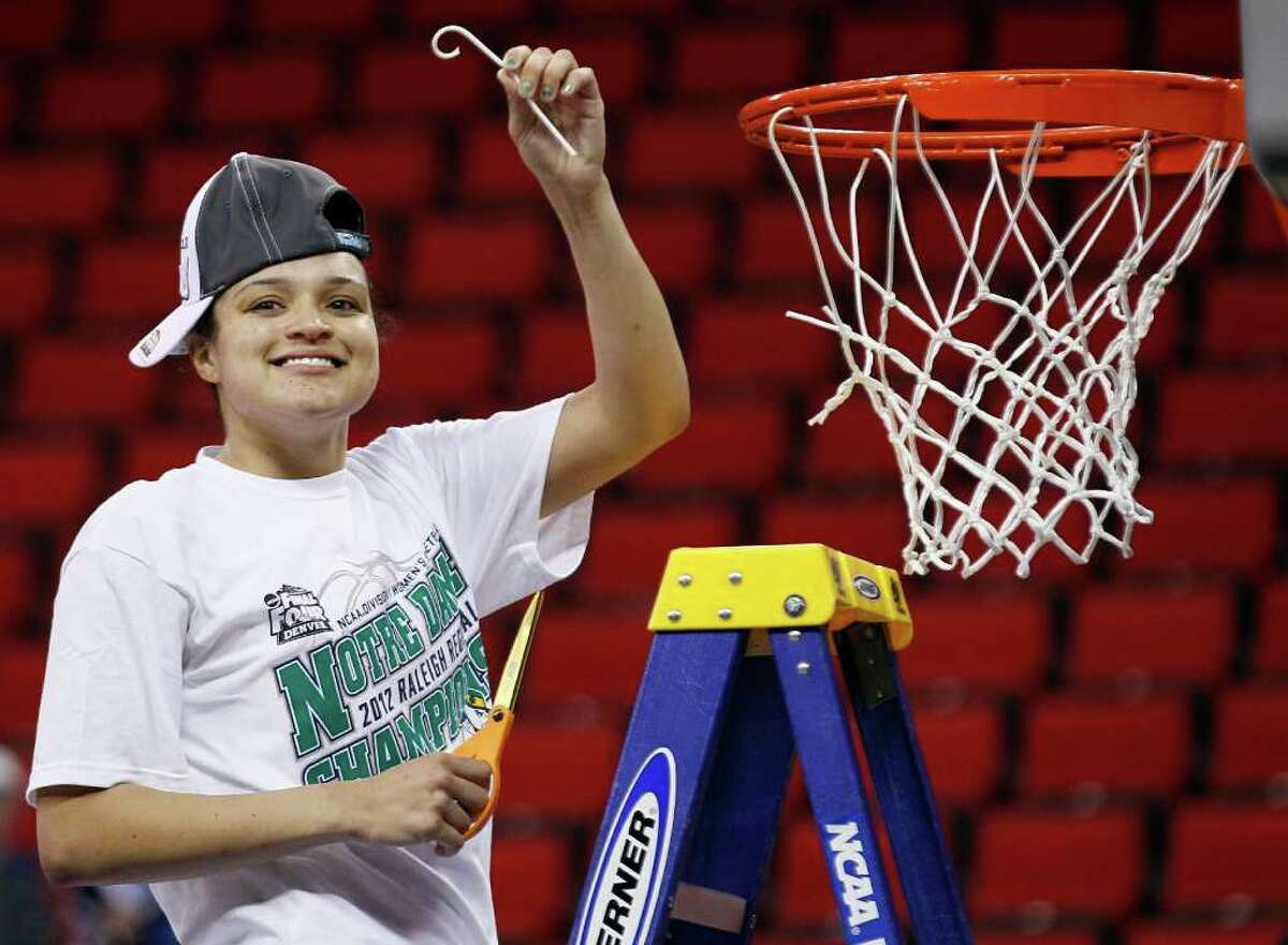Notre Dame's Kayla McBride cuts the net following an NCAA women's college basketball tournament regional final against in Raleigh, N.C., Tuesday, March 27, 2012. Notre Dame won 80-49 to advance to the Final Four. (AP Photo/Gerry Broome)