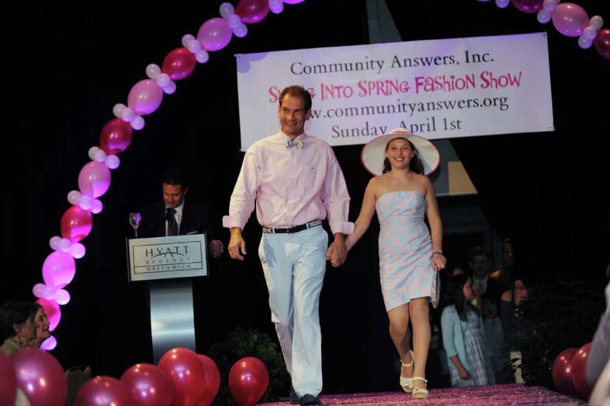 Rich Nelli and his daughter Chrissy, 11, of Riverside, model clothes from Vineyard Vines at the Community Answers' benefit "Swing into Spring" at the fashion show at Hyatt Regency Greenwich Sunday, April 1, 2012.