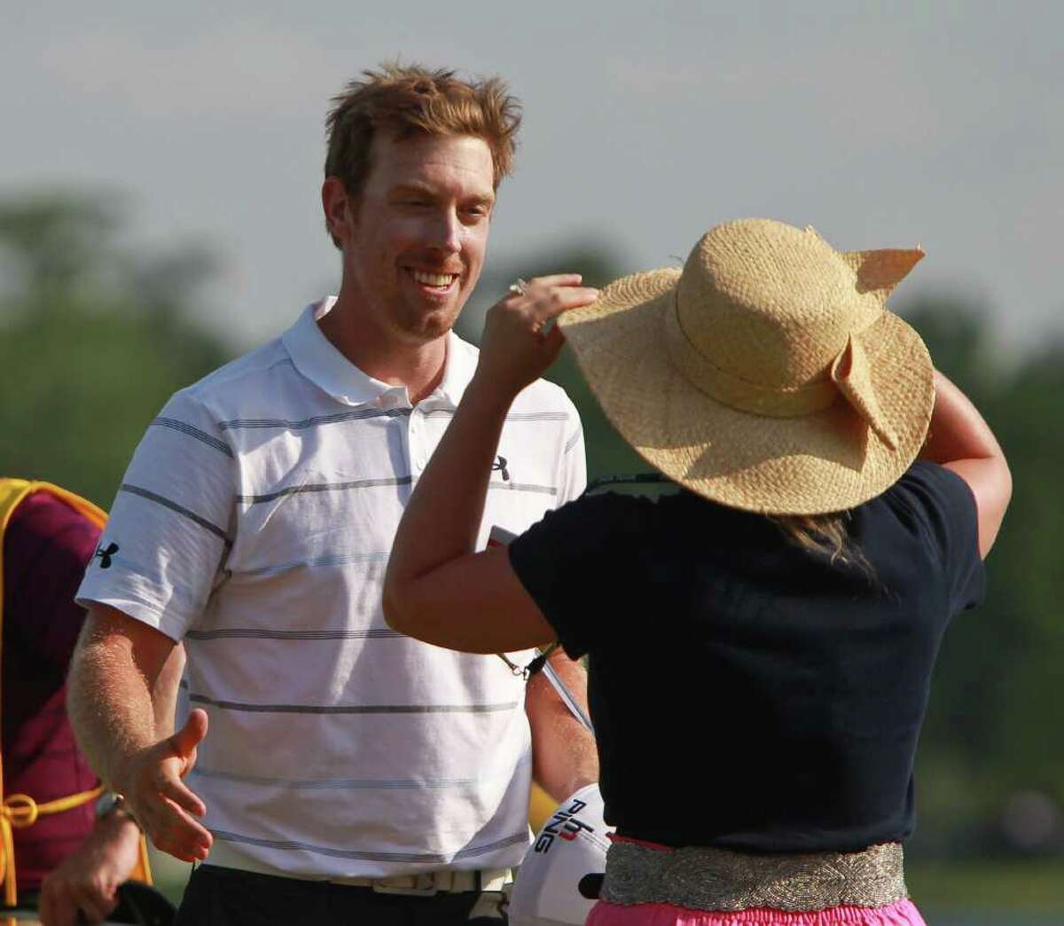 Hunter Mahan hugs his wife Kandi Mahan after winning the during the Shell Houston Open, Sunday, April 1, 2012, at the Redstone Golf Club in Humble. Mahan won with a score of 272.