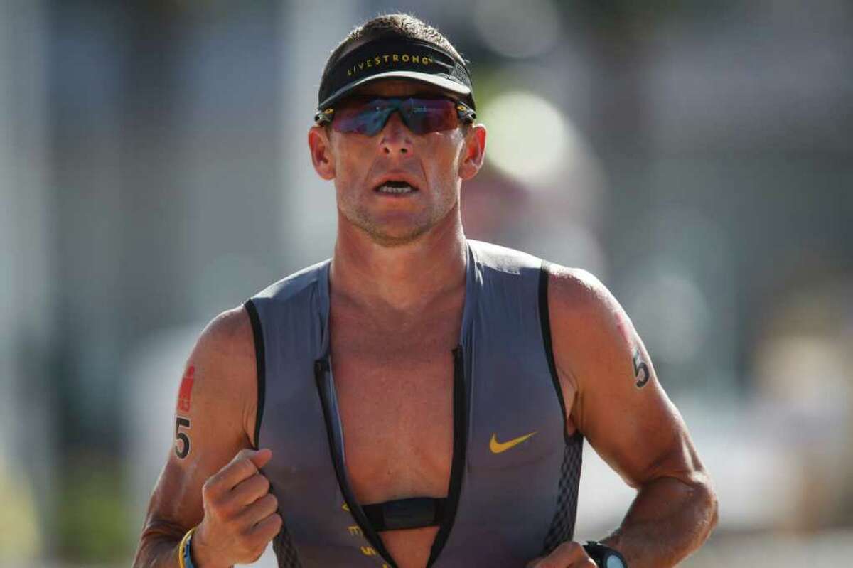 Lance armstrong surrenders lead finishes seventh in memorial hermann