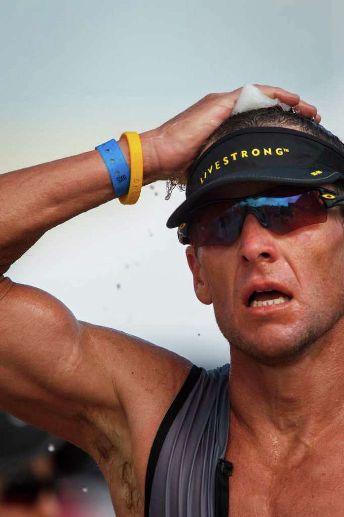 Lance armstrong surrenders lead finishes seventh in memorial hermann