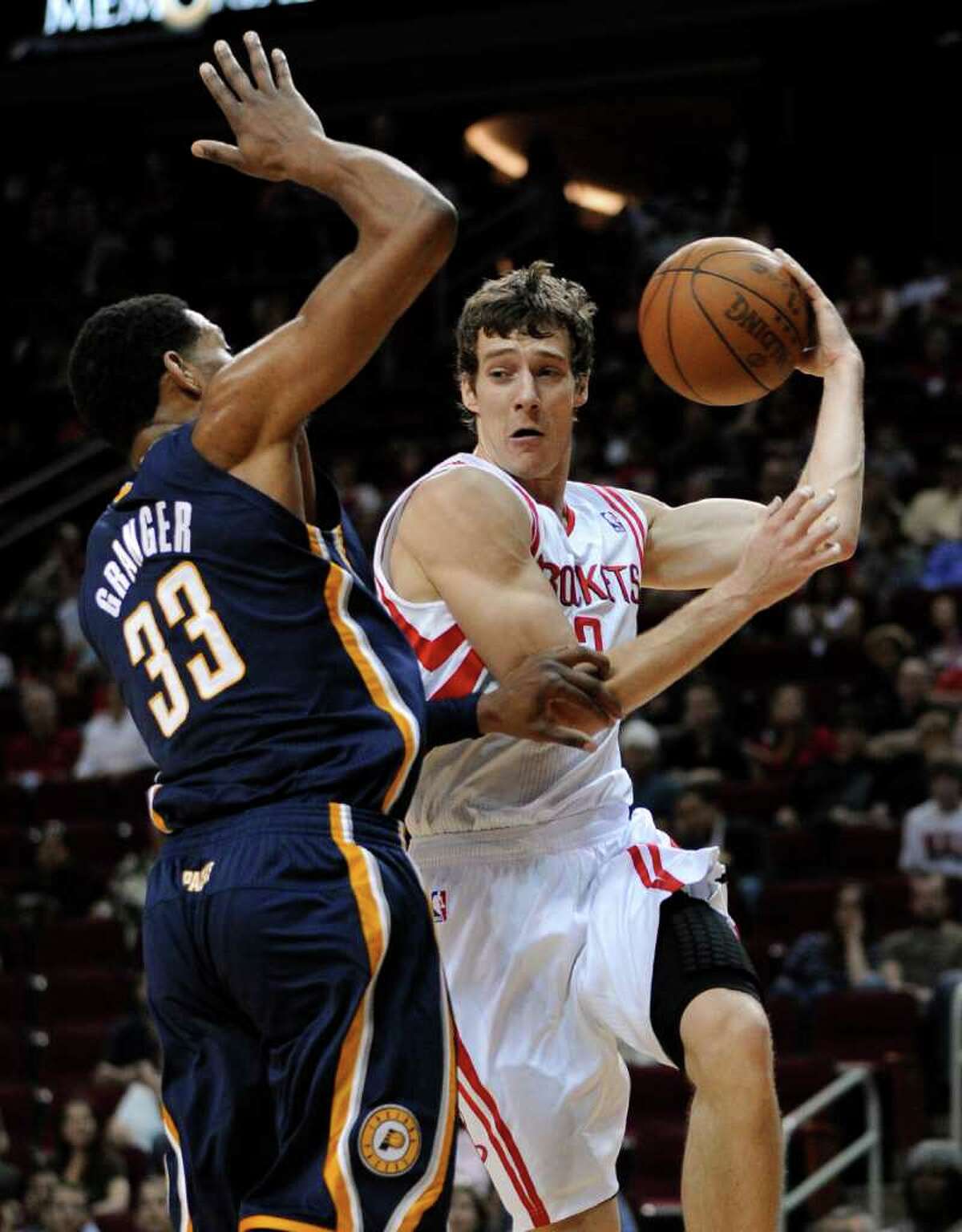 Houston Rockets' Goran Dragic (3) looks to pass the ball around Indiana Pacers' Danny Granger (33) in the first half of an NBA basketball game Sunday, April 1, 2012, in Houston. (AP Photo/Pat Sullivan)