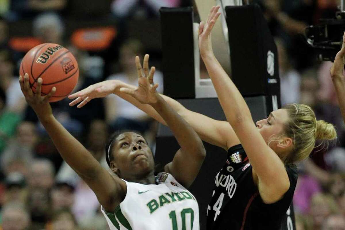 Baylor forward Destiny Williams (10) heads to the basket as Stanford forward Joslyn Tinkle (44) defends during the first half of an NCAA Women's Final Four semifinal college basketball game, in Denver, Sunday, April 1, 2012. (AP Photo/Julie Jacobson)