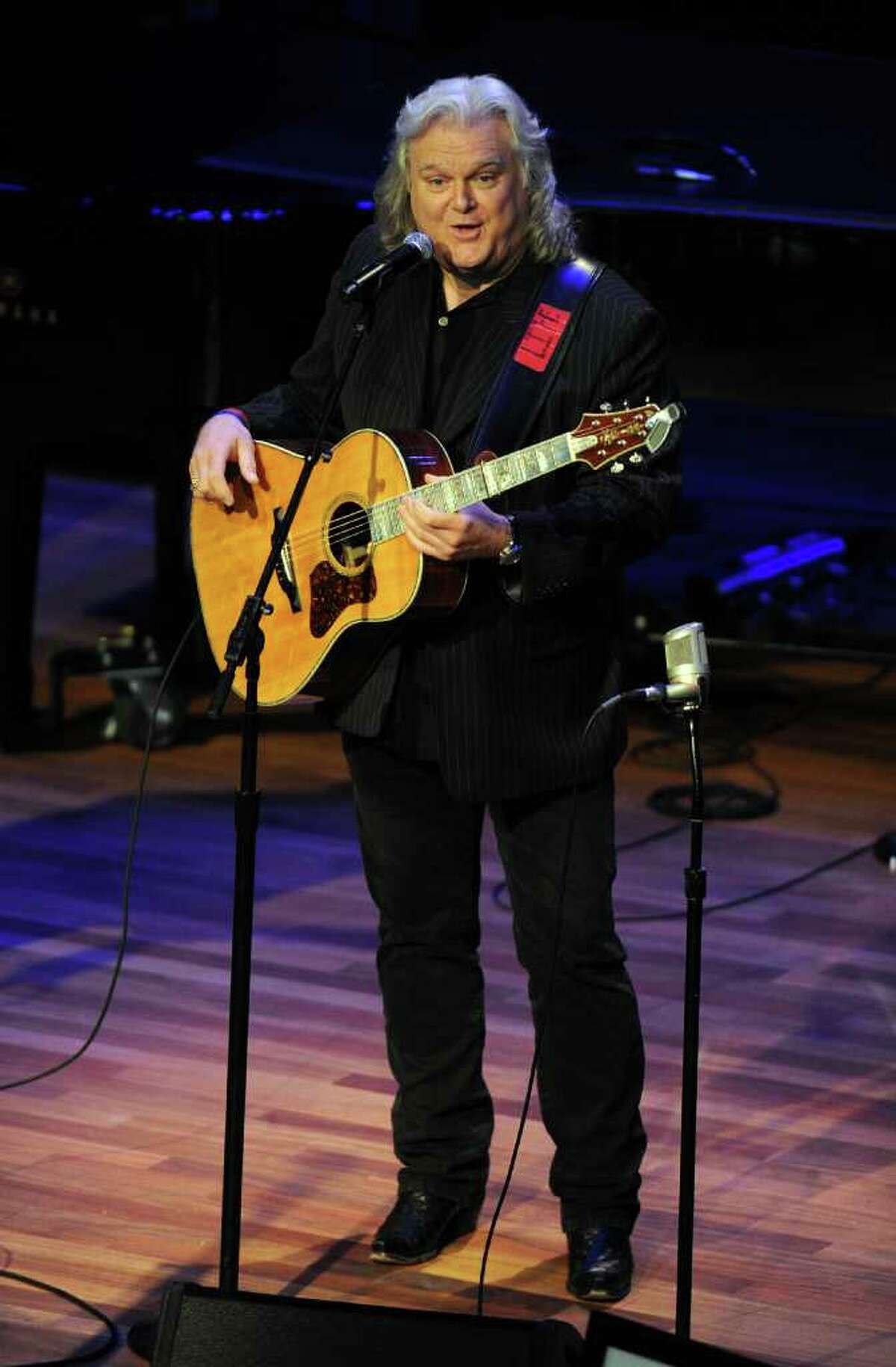 Ricky Skaggs talks about his friend Earl Scruggs during Scrugg's funeral service at the Ryman Auditorium on Sunday, April 1, 2012, in Nashville, Tenn. Scruggs died Wednesday, March 28, 2012. He was 88. (AP Photo/Joe Howell, Pool)