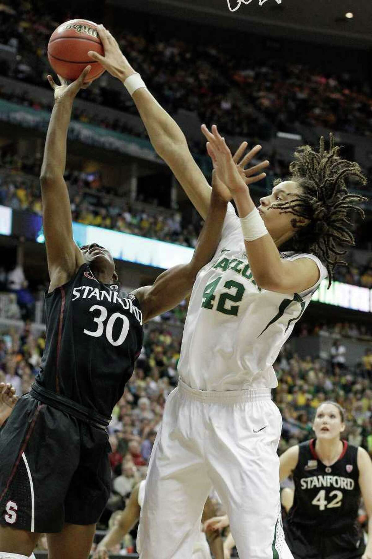 Brittney Griner (42) gets the best of fellow area pro- duct Nnemkadi Ogwumike on this play, but the Stanford star more than held her own in the inside battle.