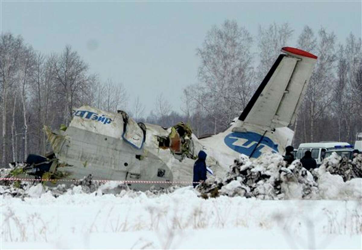 Russian Emergency ministry rescue workers search the site of the ATR-72 plane crash outside Tyumen, a major regional center in Siberia, Russia. A passenger plane crashed in Siberia shortly after take-off on Monday morning, killing 31 of the 43 people aboard, Russian emergency officials said, with 12 survivors were hospitalized in serious condition. The ATR-72, a French-Italian-made twin-engine turboprop, operated by UTair was flying from Tyumen to the oil town of Surgut with 39 passengers and four crew.