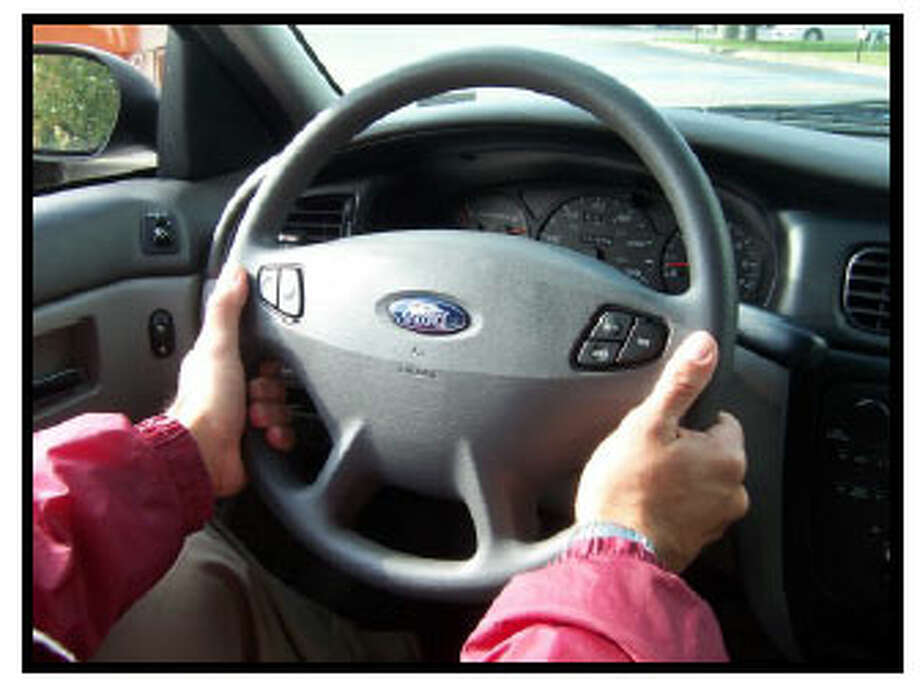 hand controls on steering wheel