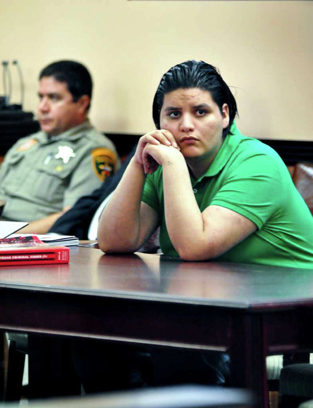 Jose "Lalo" Eduardo Arredondo on trial for the capital murder and agravated sexual assualt of two year old Katherine Cardenas, looks on as a witness approaches the stand Monday afternoon at the 49th District Court Room.