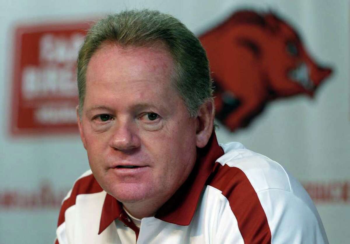 FILE - This Aug. 6, 2011 file photo shows Arkansas college football coach Bobby Petrino speaking to reporters in Fayetteville, Ark. A State Police official says Petrino crashed his motorcycle Sunday night, April 1, 2012, on Arkansas Highway 16 in Madison County near the community of Crosses, and was taken to a hospital for treatment.