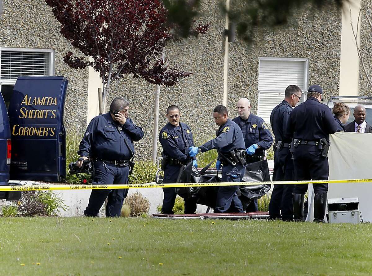 Police and coroners officials lifted one of five victims to a van. Seven people were shot and killed at Oikos University on Edgewater Street in Oakland, Calif. Monday April 2, 2012.