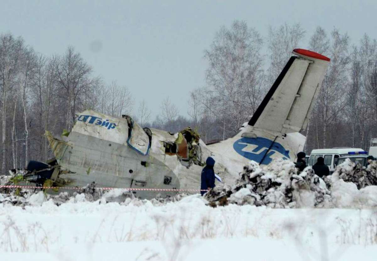 Russian Emergency ministry rescue workers search the site of the ATR-72 plane crash outside Tyumen, a major regional center in Siberia, Russia, Monday, April 2, 2012. A passenger plane crashed in Siberia shortly after take-off on Monday morning, killing 31 of the 43 people aboard, Russian emergency officials said, with 12 survivors were hospitalized in serious condition. The ATR-72, a French-Italian-made twin-engine turboprop, operated by UTair was flying from Tyumen to the oil town of Surgut with 39 passengers and four crew.