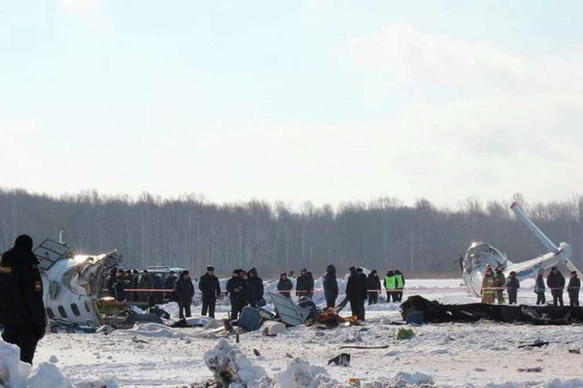 In this photo provided by Russia Emergency Situations Ministry press service, Russian emergency workers search the crash site of the ATR-72 plane crash outside Tyumen, a major regional center in Siberia, Russia, Monday, April 2, 2012. The passenger plane crashed shortly after take-off on Monday morning, killing 31 and leaving 12 survivors hospitalised in serious condition, Russian emergency officials. The French-Italian-made twin-engine turboprop ATR-72 plane was operated by UTair, flying from Tyumen to the oil town of Surgut with 39 passengers and four crew. (AP Photo/Russian Ministry of Emergency Situations press service)