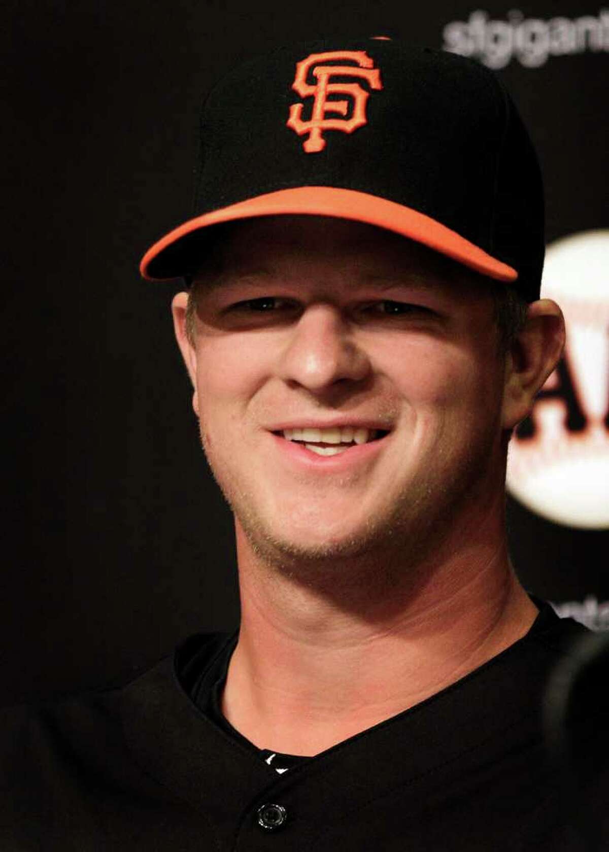 San Francisco Giants pitcher Matt Cain smiles during a news conference Monday, April 2, 2012, in San Francisco. Cain and the Giants agreed Monday to a $127.5 million, six-year contract, the largest deal for a right-handed pitcher in baseball history. The agreement adds $112.5 million over five years to the $15 million salary for 2012 that was remaining in his previous deal. (AP Photo/Ben Margot)