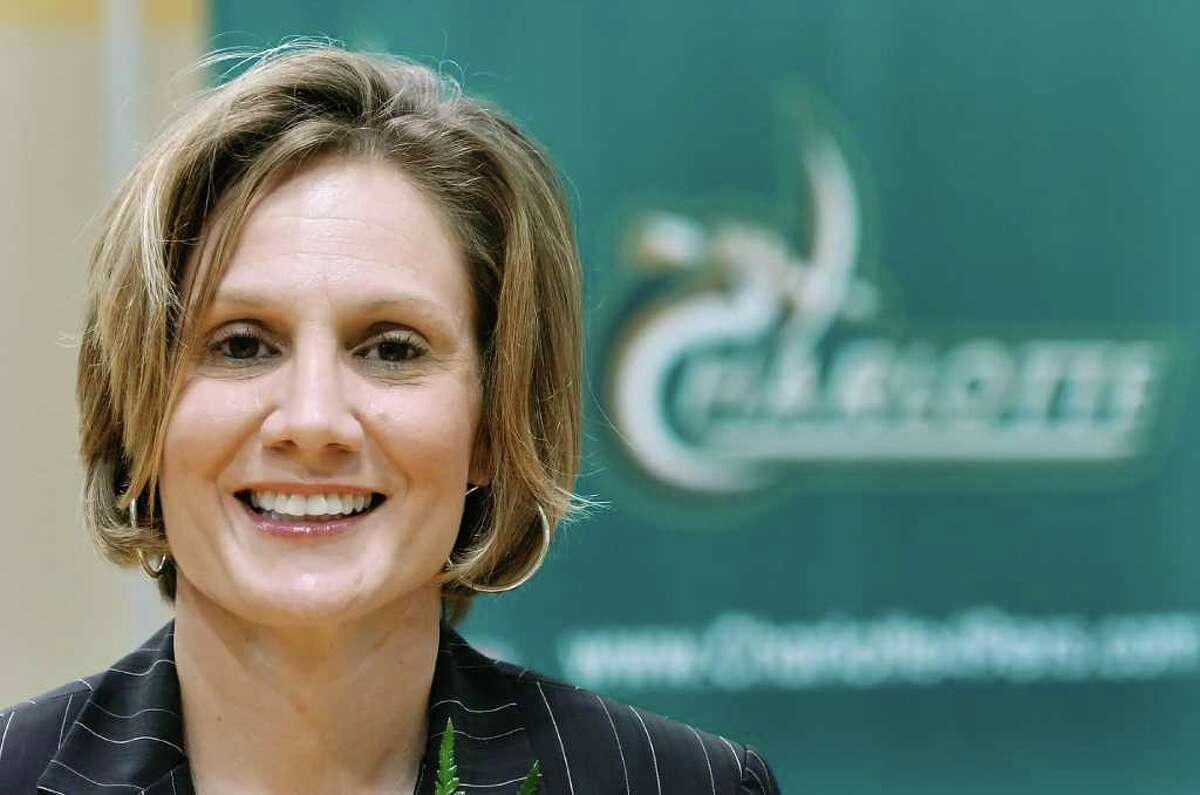 Former assistant Karen Aston smiles Friday, April 28, 2007, in Charlotte, N.C. Aston was named women's basketball coach at Charlotte, during a news conference Friday. Aston replaces Amanda Butler, who left after two seasons to become coach at Florida. (AP Photo/The Charlotte Observer, John D. Simmons)