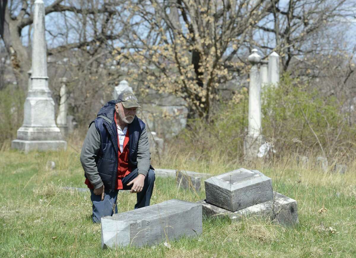 Caretaker Jim Doty looks over the damage at the Hudson View Cemetery in Mechanicville and Halfmoon, N.Y., on April 2, 2012. (Skip Dickstein/Times Union archive)