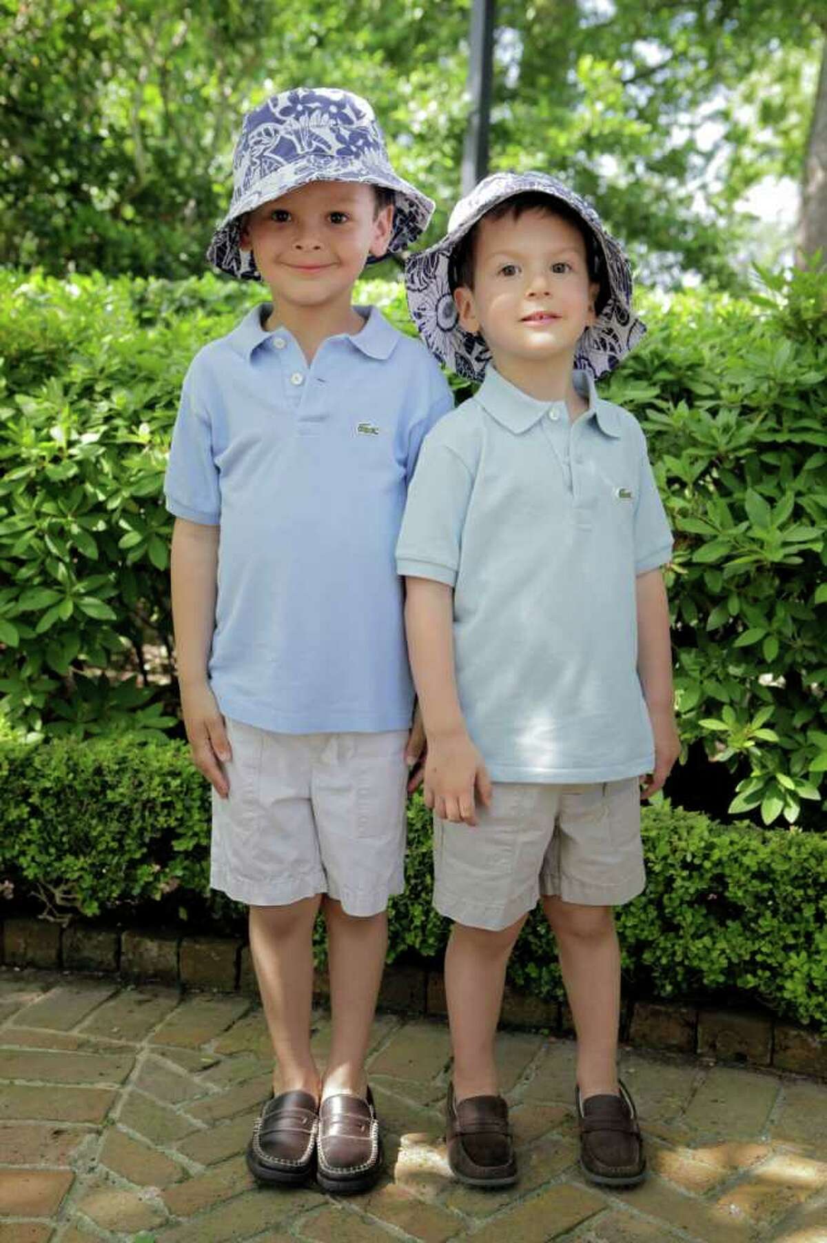 Brothers Ezra Segal, 5, left, and Nathan Segal, 3, pose for a portrait.