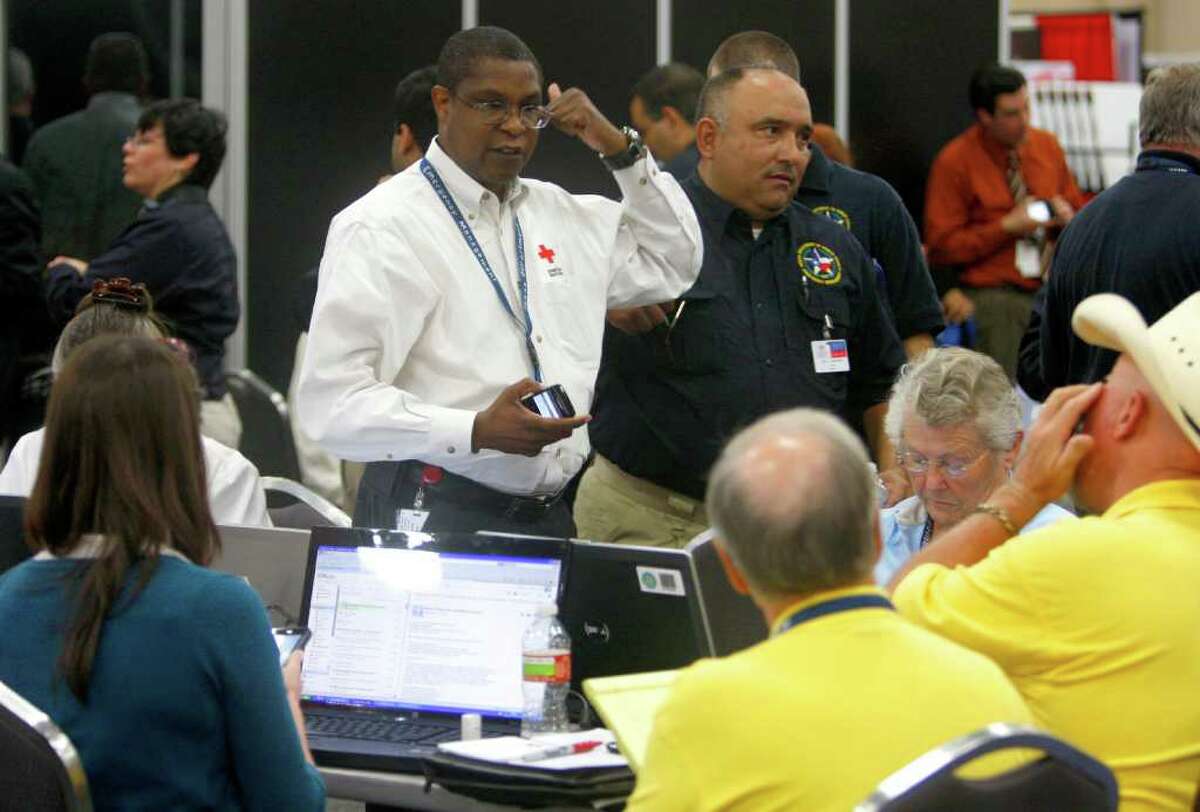 Officials work to create a temporary emergency operation center Tuesday, April 3, 2012, at the Convention Center to respond to a string of tornadoes and wide spread damage in the Dallas-Fort Worth area.