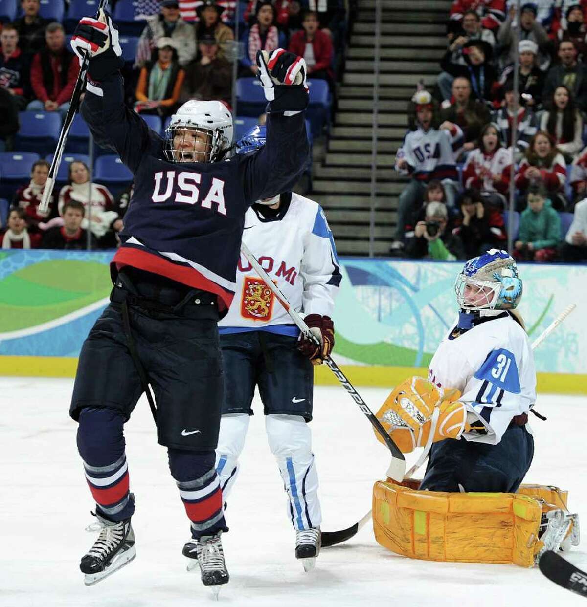 VANCOUVER, BC - FEBRUARY 18: Julie Chu of The United States celebrates scoring their first goal during the ice hockey women's preliminary game between USA and Finland on day 7 of the 2010 Vancouver Winter Olympics at UBC Thunderbird Arena on February 18, 2010 in Vancouver, Canada. (Photo by Harry How/Getty Images)
