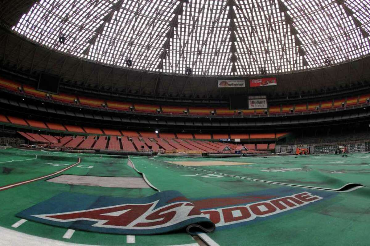 Damaged Astro Turf is seen stretched across the floor inside of Reliant Astrodome Tuesday, April 3, 2012, in Houston.